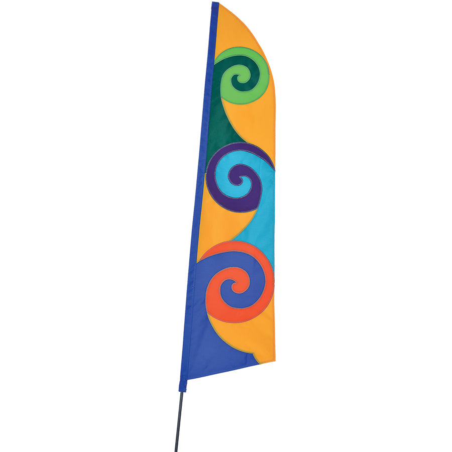 Yellow SoundWinds Pop Recumbent Bike Flag, 12x51 inches, attached to a fiberglass pole displayed on a bike, showcasing high visibility for cyclists.