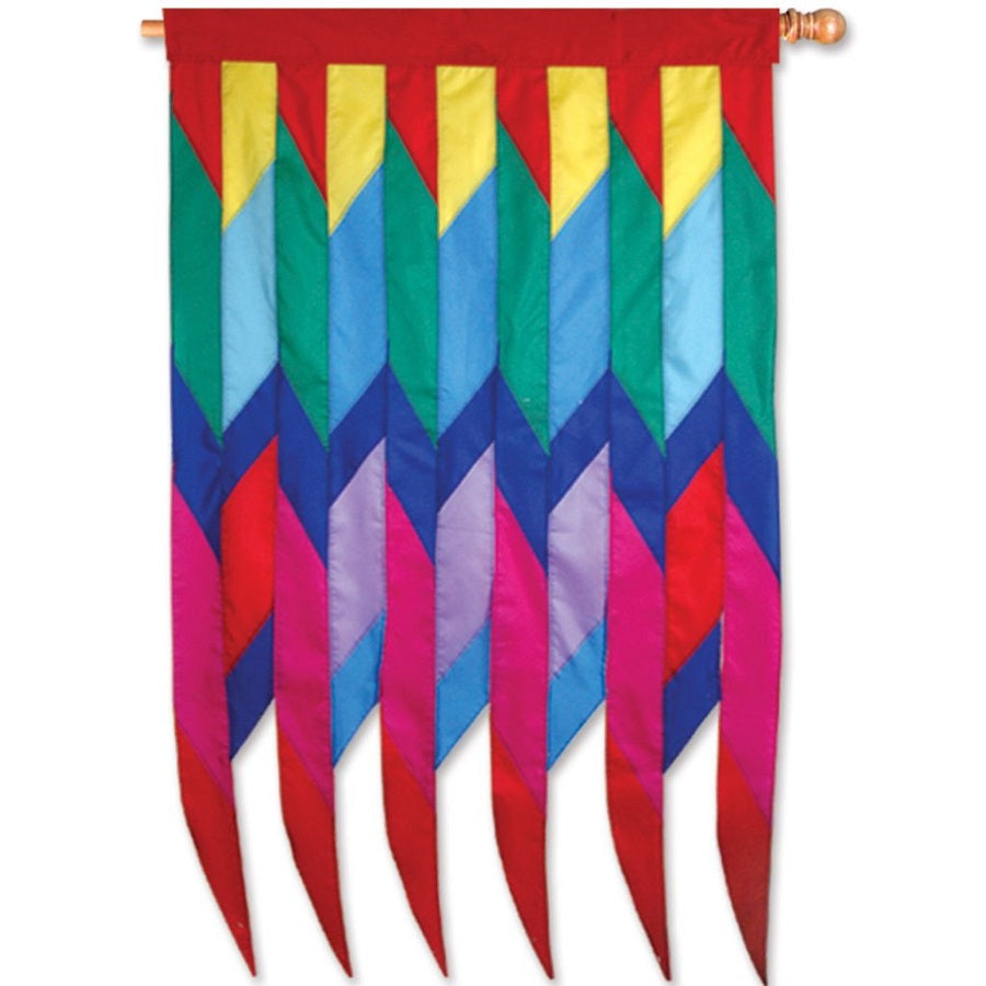 SoundWinds Progressive Banner - Cellon Rainbow, featuring vibrant colors and rhythmic graphics, displayed outdoors on a pole in a garden setting.