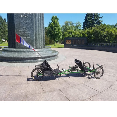 SoundWinds Reflective Fanion Recumbent Bike Flag in red, measuring 9x33.5 inches, displayed on a bike, enhancing visibility and safety on the road.