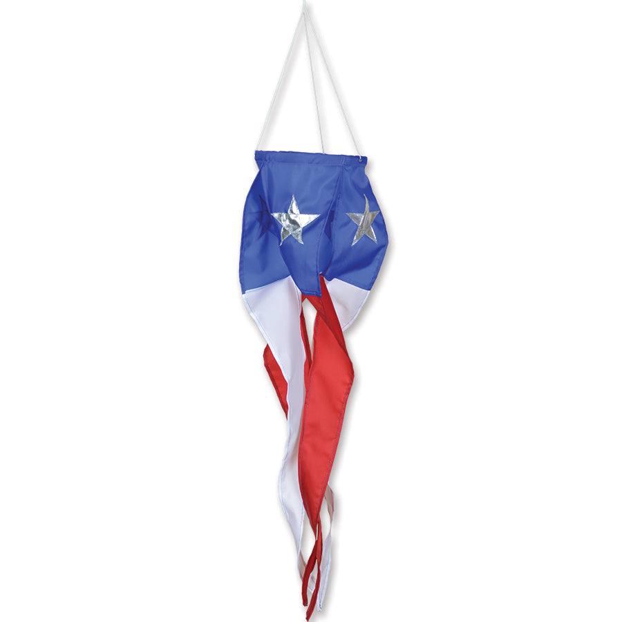 SoundWinds Small Election Day Spinner showcasing vibrant colors and patriotic designs spinning outdoors against a clear blue sky.