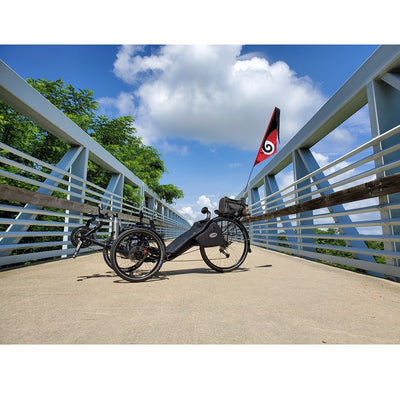 SoundWinds Spiral Recumbent Bike Flag, 9.5x33 inches, attached to a bicycle for enhanced visibility while riding outdoors.
