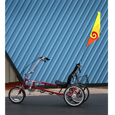 SoundWinds Spiral Recumbent Bike Flag displayed in a bright yellow color attached to a bicycle, featuring a durable pole designed for outdoor cycling.