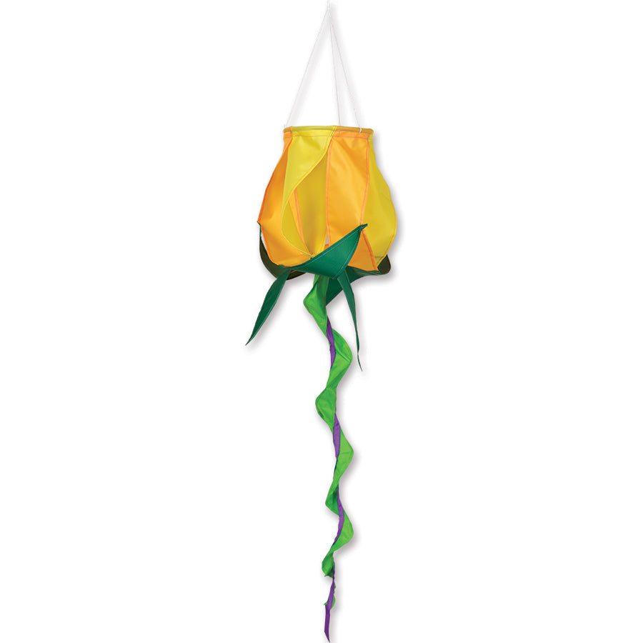 SoundWinds Yellow Rose Spinning Windsock features a bright yellow rose design in motion, hanging outdoors in a beautiful garden setting.