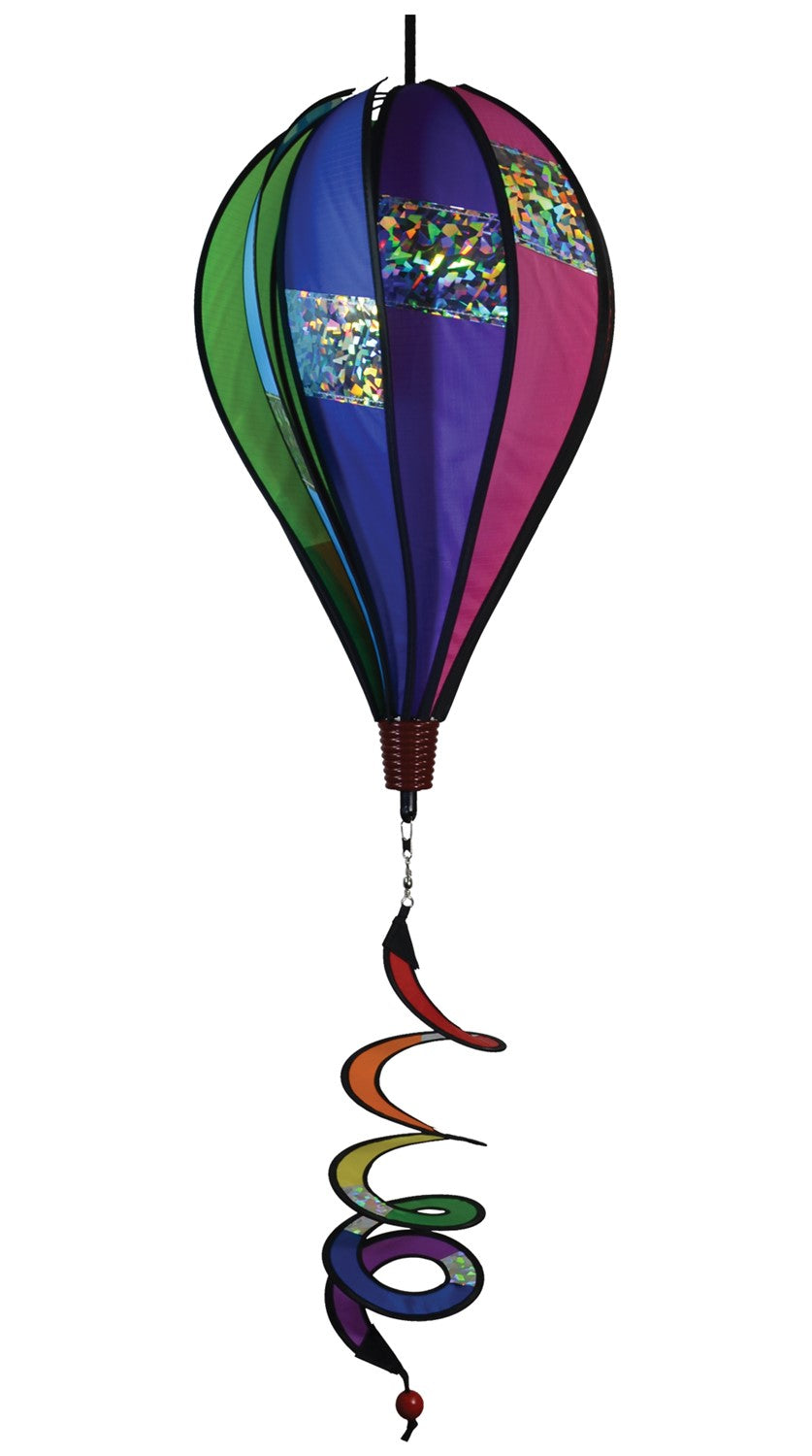 Sparkle 10-Panel Hot Air Balloon spinner in bright rainbow colors, featuring sparkling Mylar, displayed outdoors, capturing sunlight as it spins.