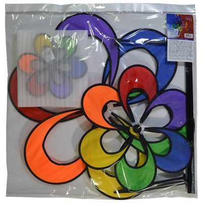 Spectrum Triple Windee Wheelz colorful garden spinner featuring three rotating rainbow flowers, displayed outdoors in a sunny garden setting.