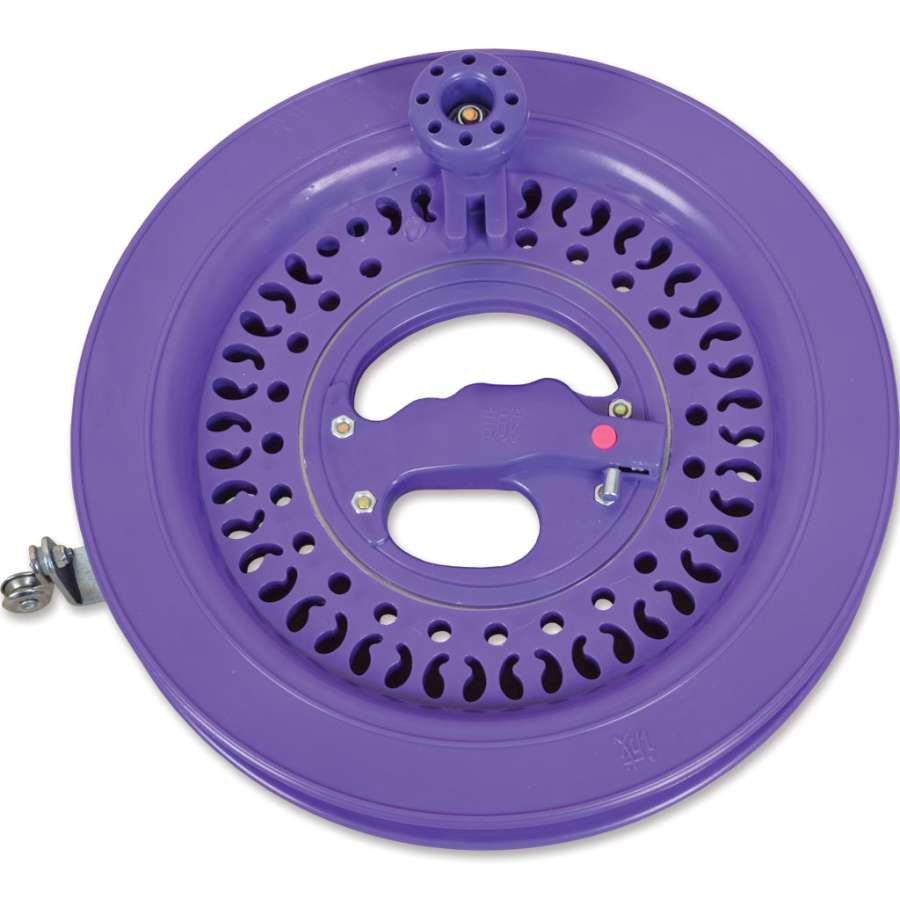 Speedy Winder Reel Device for Kites, an 11-inch diameter kite reel made of high-impact ABS with smooth operation features displayed outdoors.