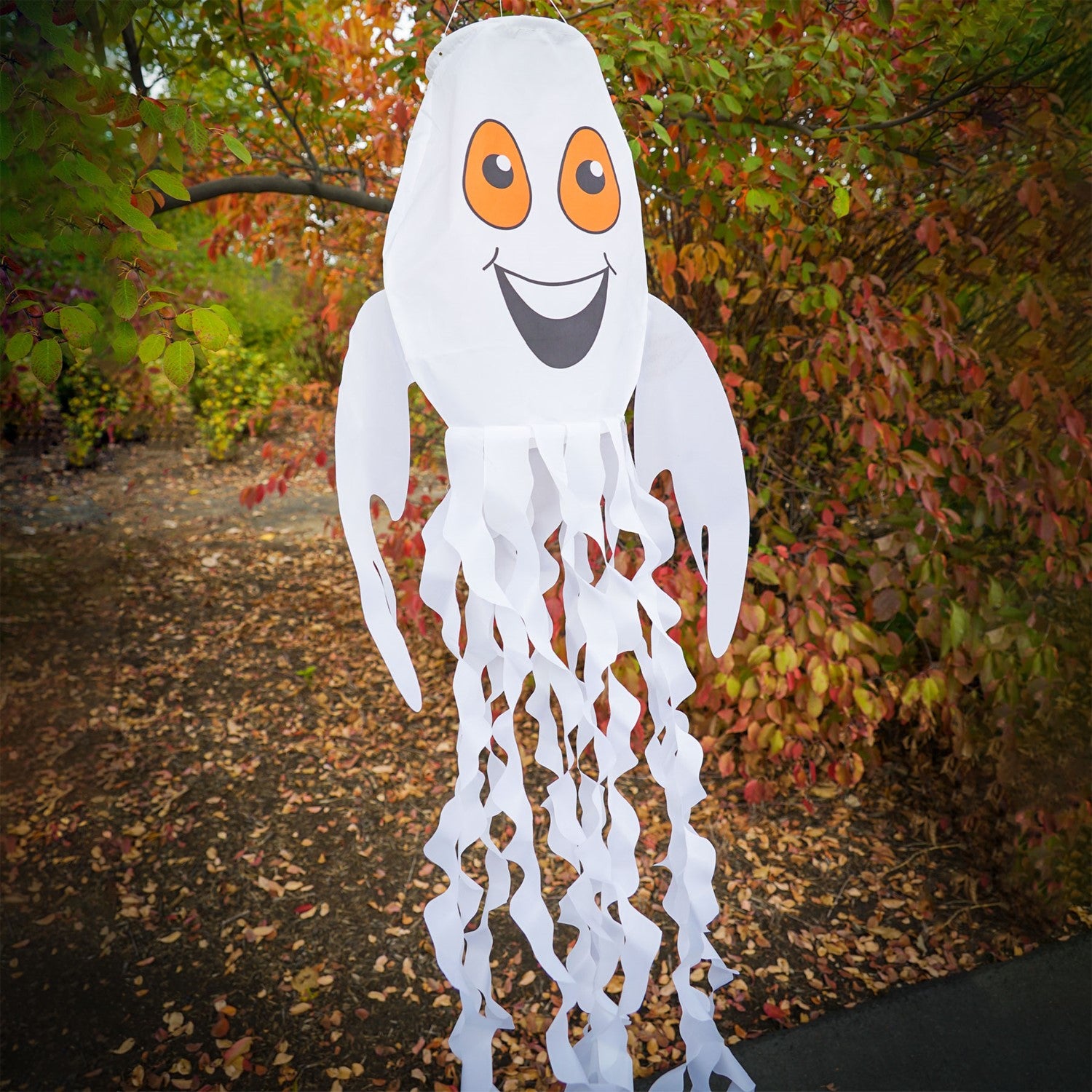 Spook the Ghost 3D Windsock hanging outdoor, featuring a cheerful ghost design with fluttering streamer tails perfect for Halloween decor.