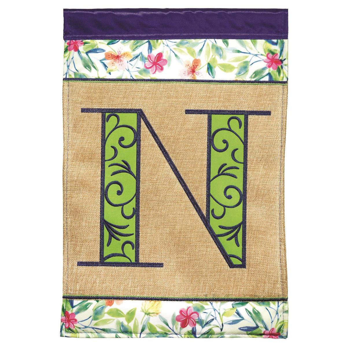 Spring Burlap Monogram-N Garden Flag displayed in a garden, showcasing intricate embroidery and a mix of satin-smooth and burlap textures.