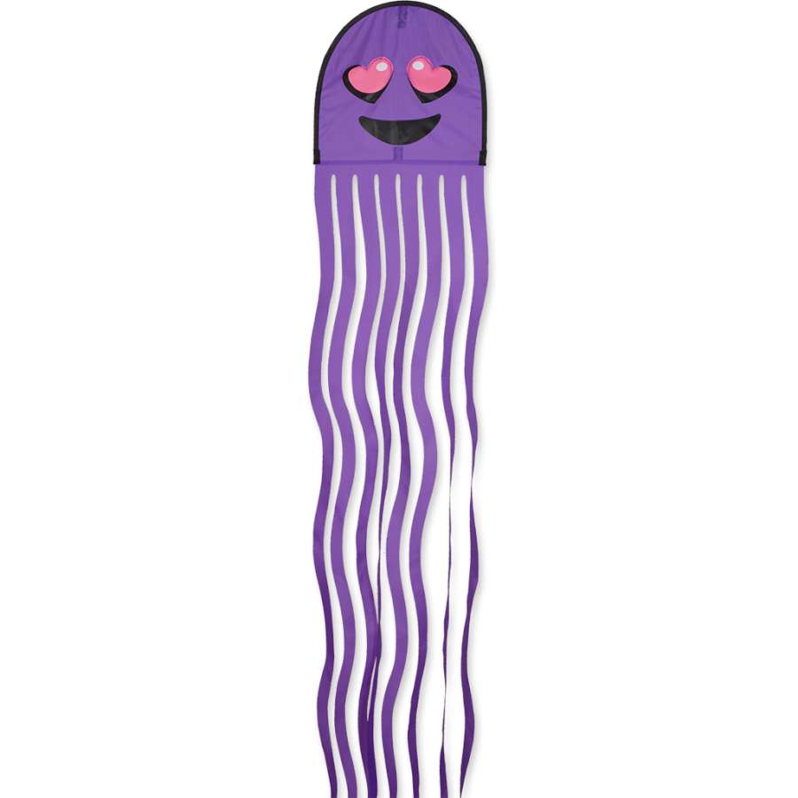 Squeaker Kite displaying vibrant octopus design with backlit eyes, flying in a clear blue sky, showcasing its 13.75 x 128-inch size.