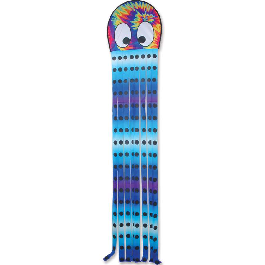 Squeaky Kite featuring an octopus design flying joyfully in a clear blue sky with colorful tails trailing behind.