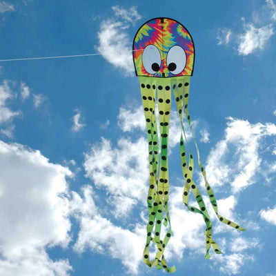 Colorful tie-dye Squeaky Kite shaped like an octopus soaring through the sky, measuring 20 x 80 inches, providing fun for families outdoors.