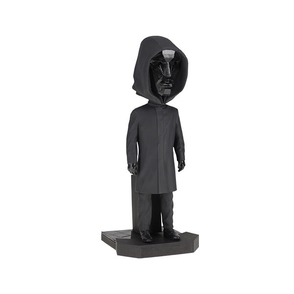 8-inch Squid Games Front Man Bobblehead featuring intricate details, black outfit, and mask, displayed prominently on a shelf.