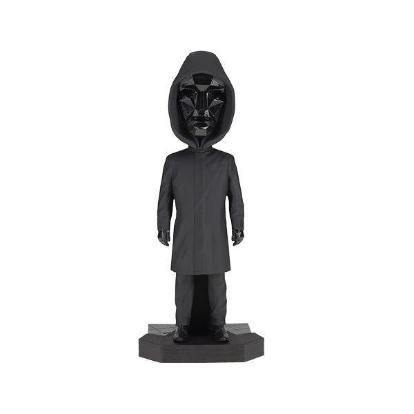 8-inch Squid Games Front Man Bobblehead featuring intricate details, black outfit, and mask, displayed prominently on a shelf.