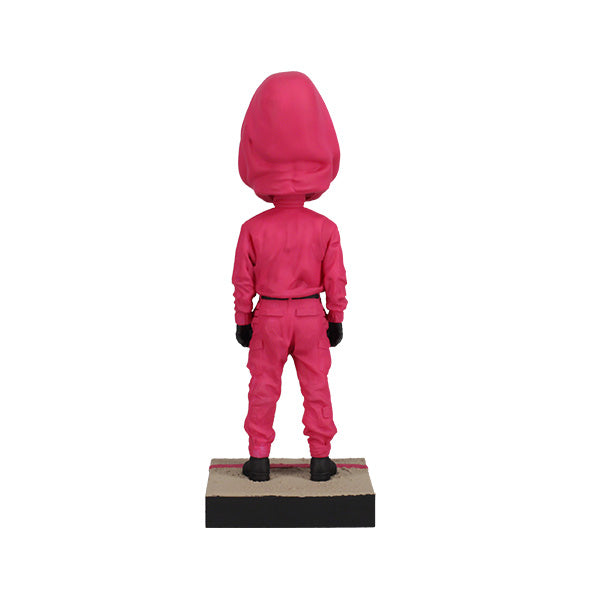 Squid Games Masked Guard Bobblehead featuring a red-suited figure with a black mask in a detailed design, showcasing its unique craftsmanship.