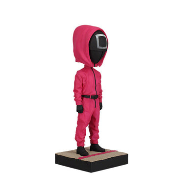 Squid Games Masked Guard Bobblehead featuring a red-suited figure with a black mask in a detailed design, showcasing its unique craftsmanship.