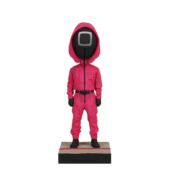 Squid Games Masked Guard Bobblehead featuring a red-suited figure with a black mask in a detailed design, showcasing its unique craftsmanship.