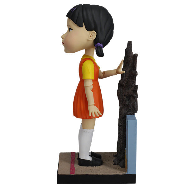 Squid Games Young-Hee Doll 10" bobblehead with detailed features and nodding action, perfect for horror collectors and fans of the series.