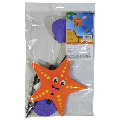 Starfish Whirligig featuring a colorful starfish design spins gracefully in the breeze, set against a vibrant outdoor garden backdrop, enhancing seaside charm.