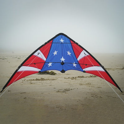 Stars & Stripes 48-inch sport kite with red, white, and blue design flying against a blue sky, showcasing its vibrant colors and dual control.