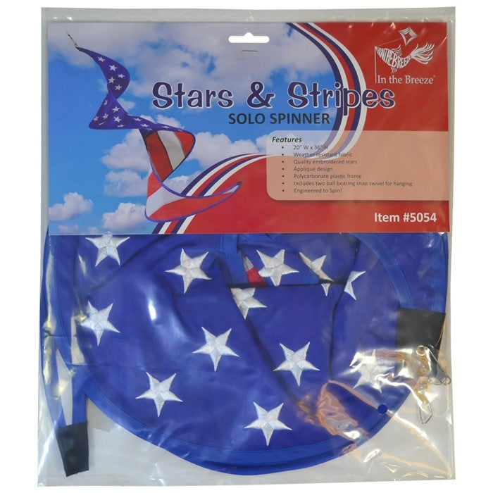 Stars & Stripes Solo Spinner hanging outdoors, showcasing the American flag design with vibrant red, white, and blue colors in motion.