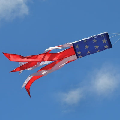 33-inch Stars and Stripes windsock in vibrant red, white, and blue displayed outdoors, showcasing silk-screened stars and colorful tails.