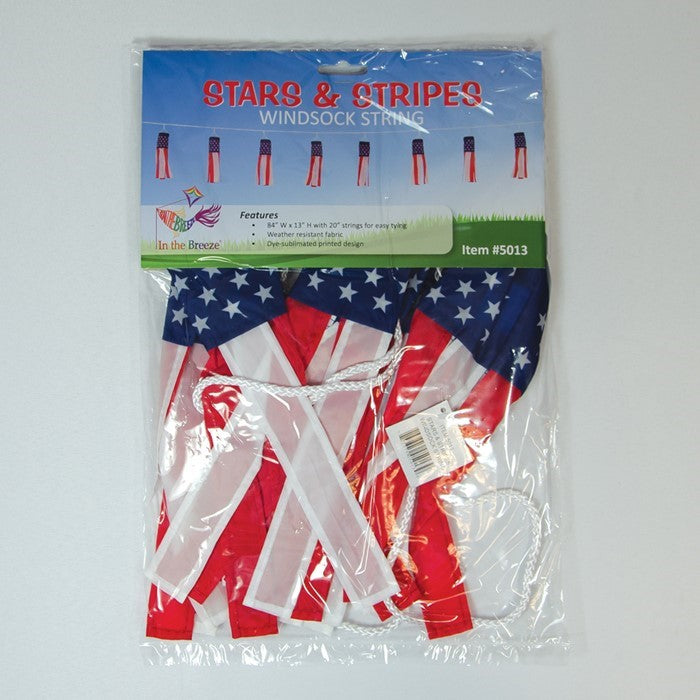 Stars & Stripes String of Babysocs featuring eight 12-inch windsocks swaying in the breeze, showcasing vibrant patriotic colors outdoors.