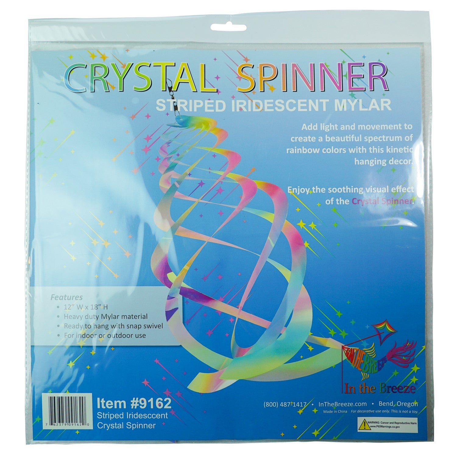 Vibrant Striped Iridescent Crystal Spinner made of Mylar, hanging outdoors with colorful reflections in sunlight, perfect for garden decor.
