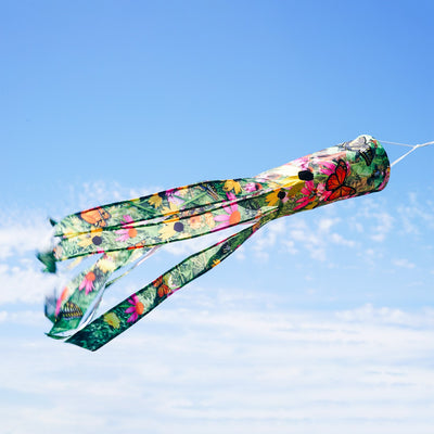 Summer Garden 40-Inch Illusion Windsock with vibrant printed design and embroidered details, gracefully hanging outdoors in a sunny garden setting.