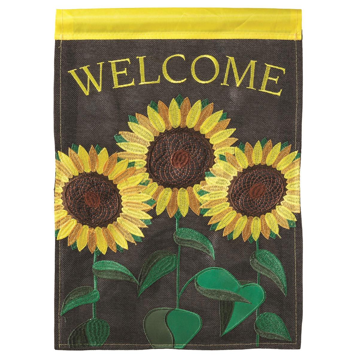 Sunflowers Burlap Garden Flag featuring a vibrant sunflower design in intricate appliques and embroidery, displayed outdoors.