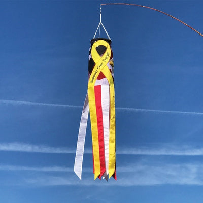 Vibrant Support Our Troops 40'' windsock displaying an eagle and patriotic colors in a front yard setting, representing military support.
