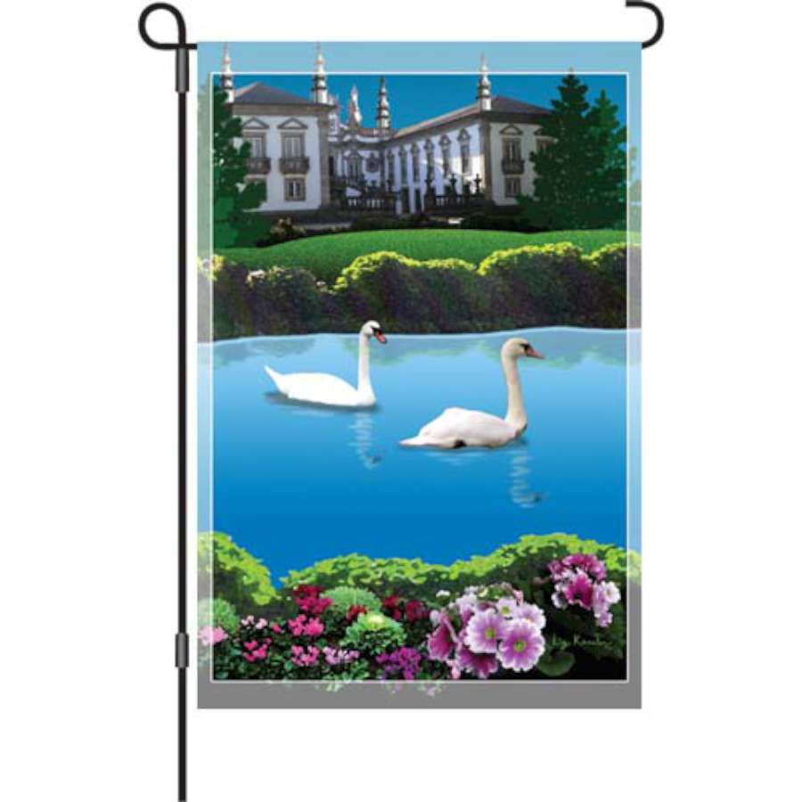 12 in. Swan Lake garden flag illuminated, featuring a graceful swan on a lake, enhancing a garden's tranquil atmosphere.
