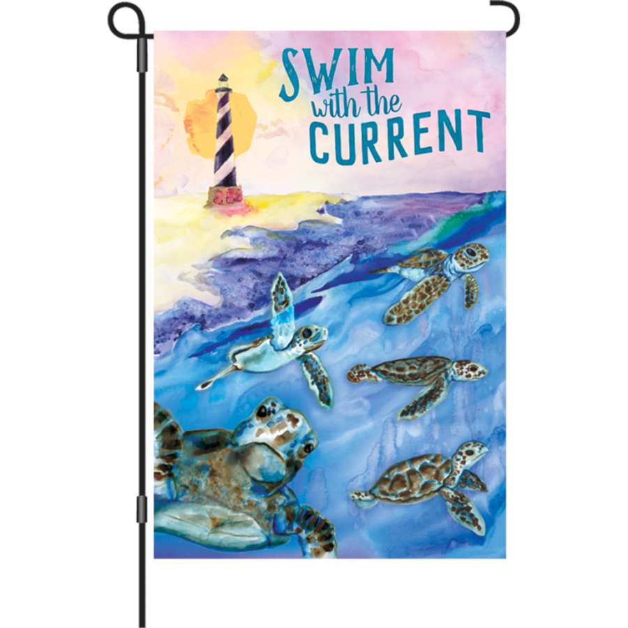 12 in. Swim With The Current flag featuring vibrant colors and text displayed outdoors, lightly swaying in a summer breeze.