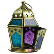 Teal & Purple Hex Glass Tealight Lantern featuring intricate glass and metal design, ready for use to illuminate indoor or outdoor spaces.
