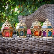 Teal & Purple Hex Glass Tealight Lantern featuring intricate glass and metal design, ready for use to illuminate indoor or outdoor spaces.