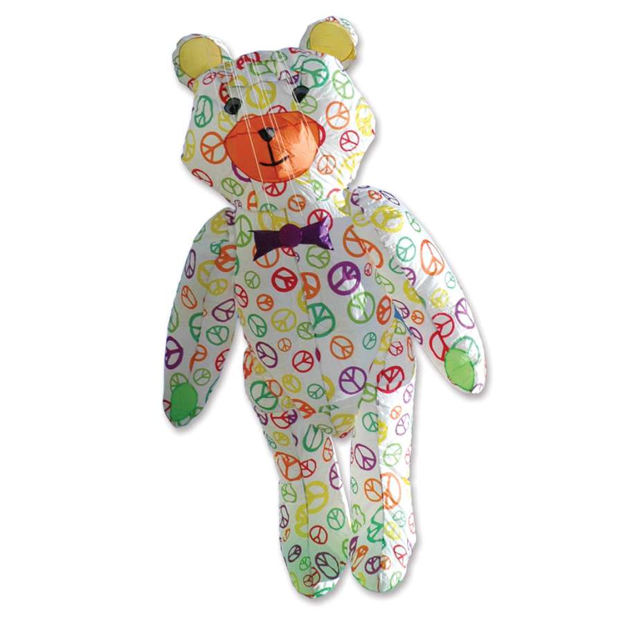 Teddy Bear Kite featuring colorful peace signs flying in a clear blue sky, showcasing its vibrant design and impressive size.