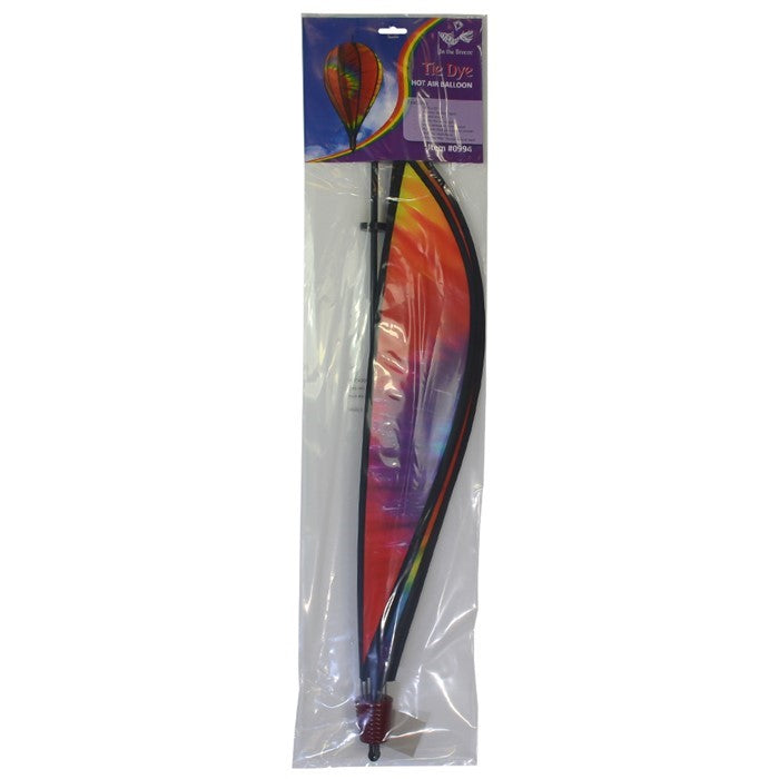Tie Dye 10-Panel Hot Air Balloon Spinner in motion, showcasing its colorful trademark design, elegantly spinning in a gentle breeze outdoors.