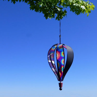 Vibrant Tie Dye 6-Panel Hot Air Balloon garden spinner hanging in a sunny outdoor setting, showcasing colorful tie-dye pattern.