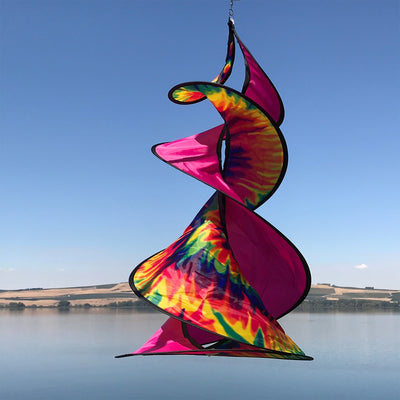 The Tie Dye Spin Duet featuring colorful tie-dye patterns, spinning gracefully in an outdoor setting, perfect for garden decor.