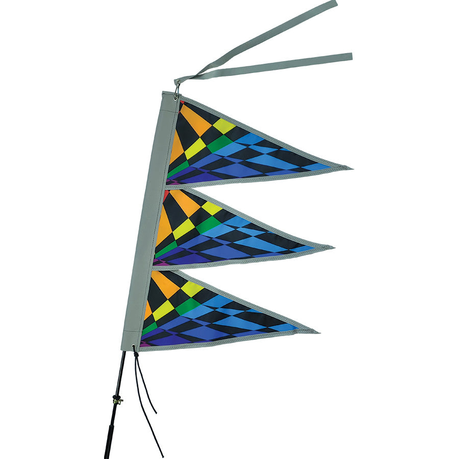 Tri-Stack Bike Flag in Rainbow Check pattern displayed on a bike, featuring bold colors and a reflective top tassel for enhanced visibility.