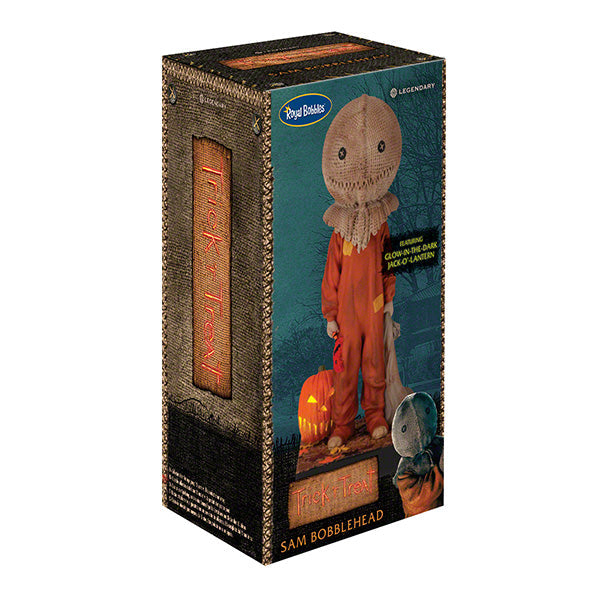 Trick 'r Treat Sam Glow in the Dark Bobblehead displayed on a shelf, showcasing its intricate detail and glowing effect in a dimly lit room.