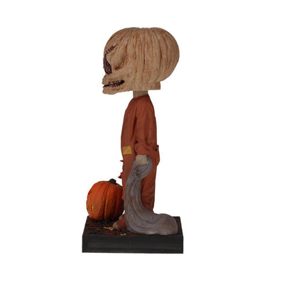 Trick 'r Treat Sam Unmasked Bobblehead standing 6 inches tall, featuring detailed craftsmanship of Sam from the Halloween classic film.