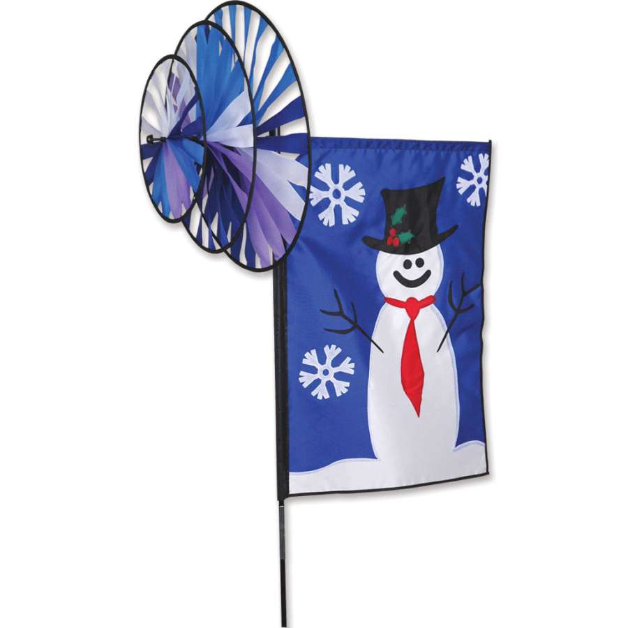 Triple Spin Banner featuring a cheerful snowman design, measuring 17x24 inches, gently spinning in the winter wind in an outdoor garden setting.