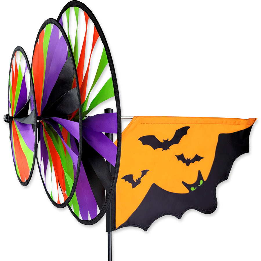 Triple Spinner - Halloween Bats with enchanting bats set against an orange sky, spinning in an outdoor garden setting.