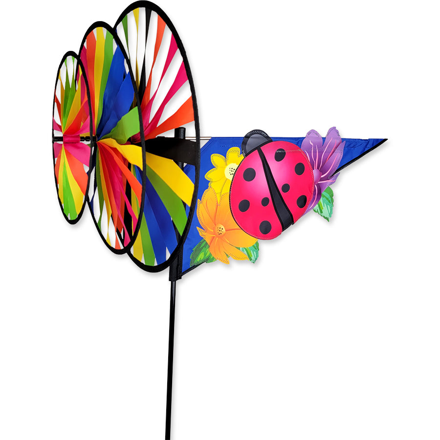 Triple Spinner - Pink Ladybug garden spinner with vibrant colors, made from fade-resistant SunTex fabric, spinning in a garden setting.