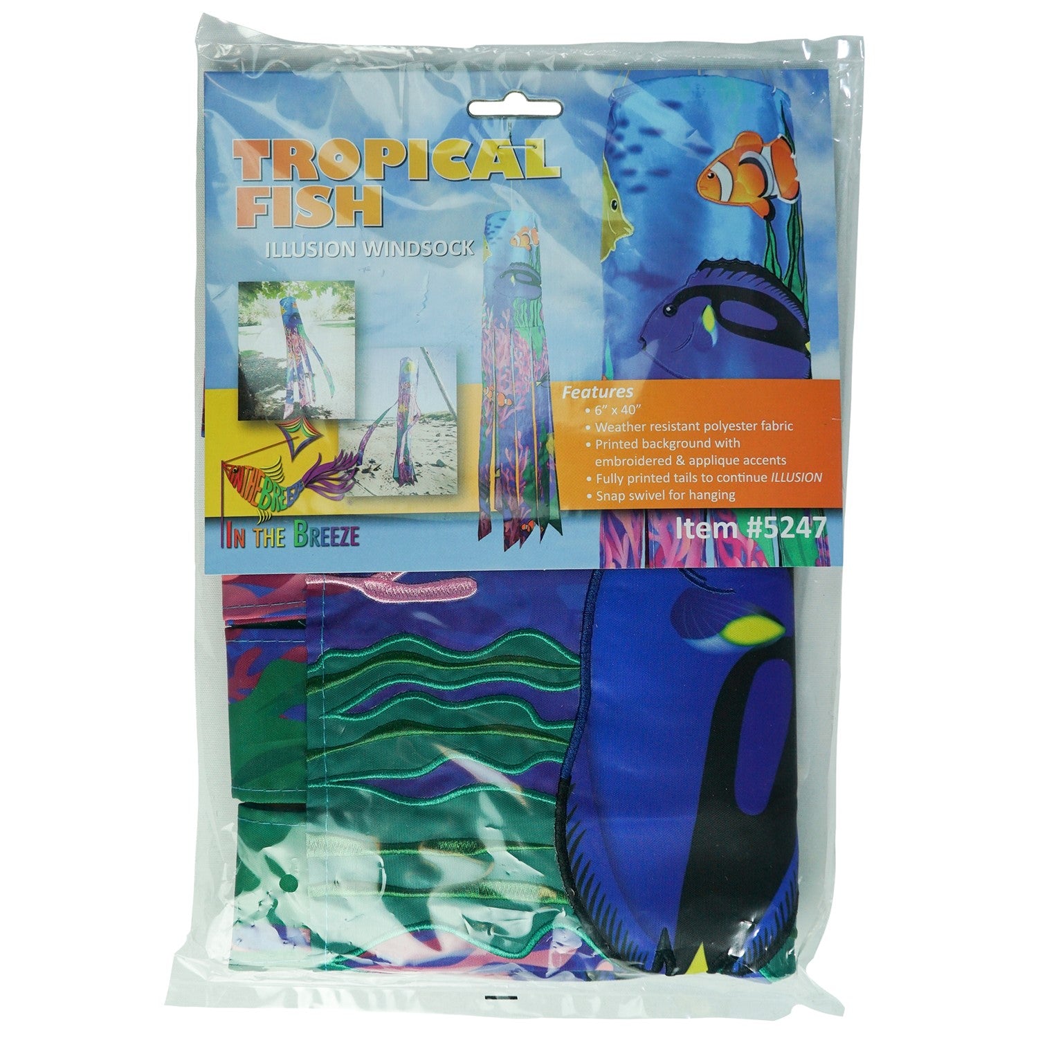 Tropical Fish 40\" Illusion Windsock displaying a vivid fish design and colorful tails, fluttering in a gentle breeze in a garden setting.