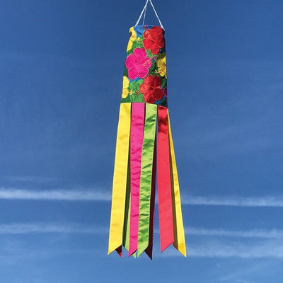 Vibrant Tropical Flowers 40" Windsock featuring hibiscus and leaves in colors that flutter gracefully in the outdoor breeze, enhancing garden decor.