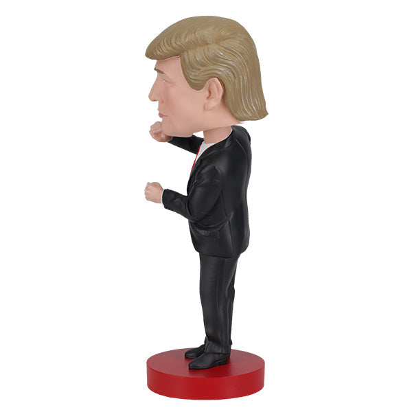 Trump Dance Bobblehead displaying Donald Trump in a suit with a playful dance pose, highlighting vibrant details for political humor lovers.