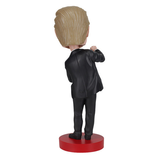 Trump Dance Bobblehead displaying Donald Trump in a suit with a playful dance pose, highlighting vibrant details for political humor lovers.