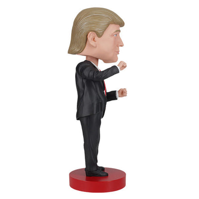 Trump Dance Bobblehead displaying Donald Trump in a suit with a playful dance pose, highlighting vibrant details for political humor lovers.