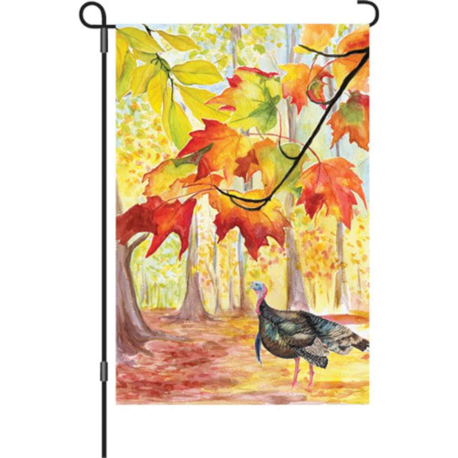 12 in. illuminated garden flag featuring a colorful turkey design, perfect for outdoor Thanksgiving decor in a fall setting.